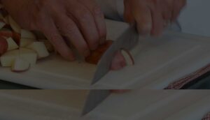 Chef cutting potatos