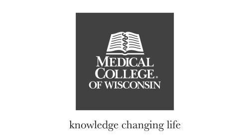 Medical College of Wisconsin black and white logo displayed on signage, representing healthcare education and research in Milwaukee.