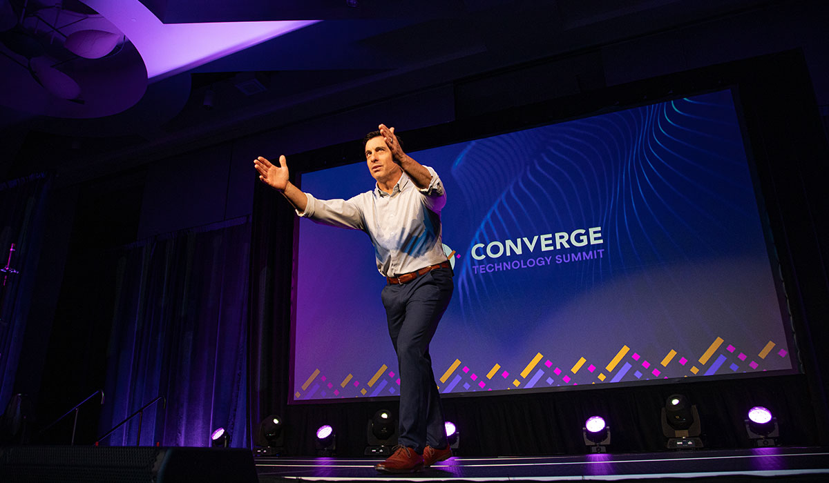 Keynote speaker at the Baird Center in Milwaukee captured mid-gesture during a high-impact presentation