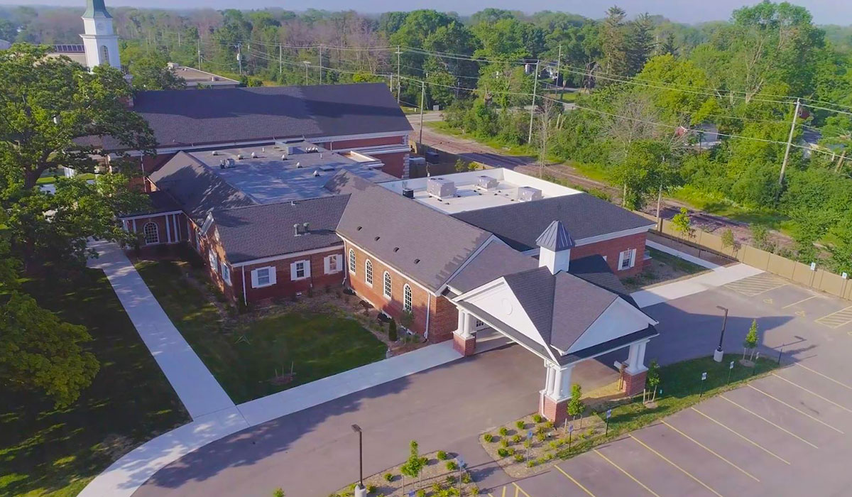 Drone Aerial of Church Porte-Cochère and Mini-Steeple Entry Aerial view of porte-cochère with mini-steeple at main church entrance