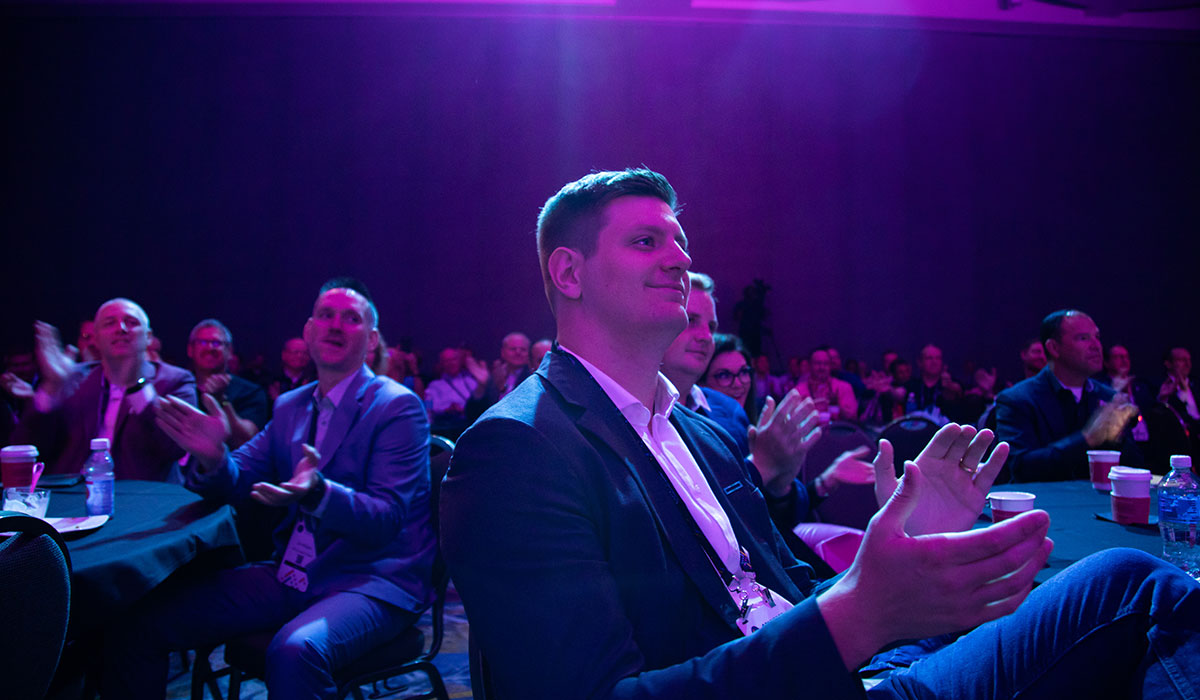 Captivated Audience at Converge Keynote in Baird Center Audience members intently watching a keynote speaker during the Converge Technology Summit at the Baird Center in Milwaukee
