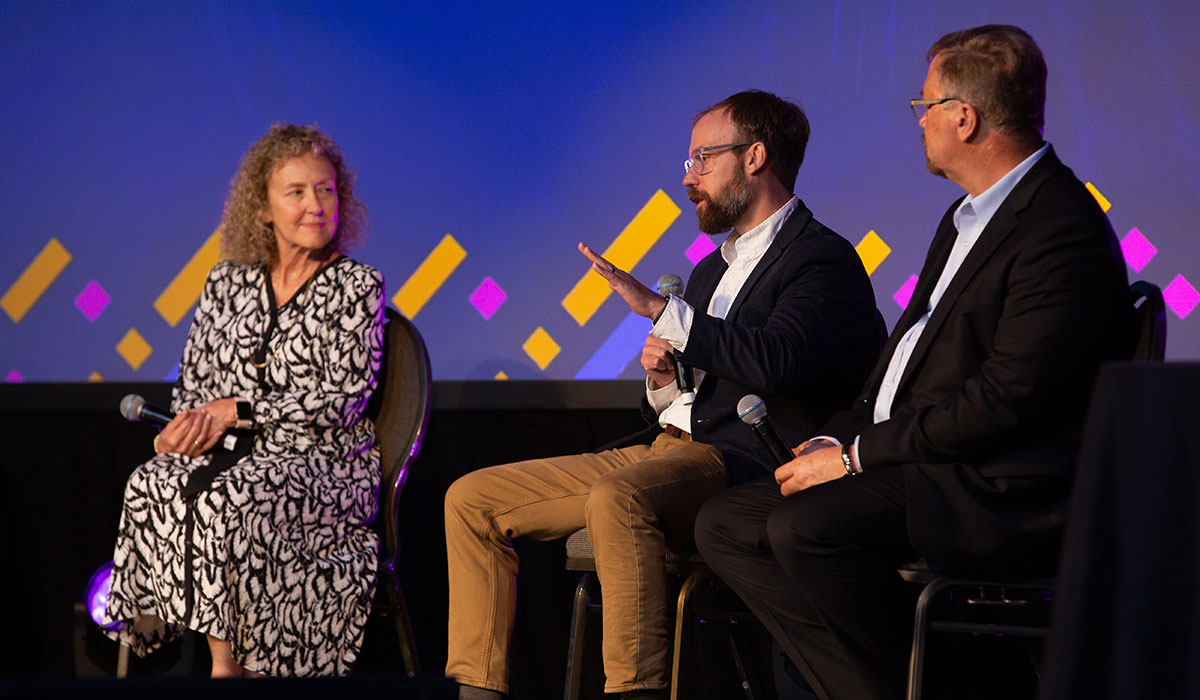 Industry Panel Close-Up at Converge Summit – Milwaukee Close-up of industry panelists from IBM, HP, and Fortune 1000 companies speaking at the Converge Technology Summit in Milwaukee