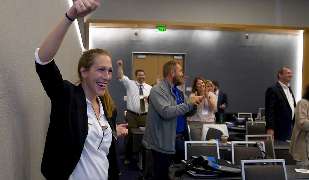 Participants celebrate with energy and joy at the DECM 2023 conference, captured for event video production at Brookfield Conference Center